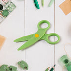 Plastic safety scissors with bright colorful handles designed for preschoolers