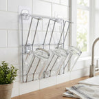 Wall-mounted stainless steel mug holder rack with cups and mugs hanging