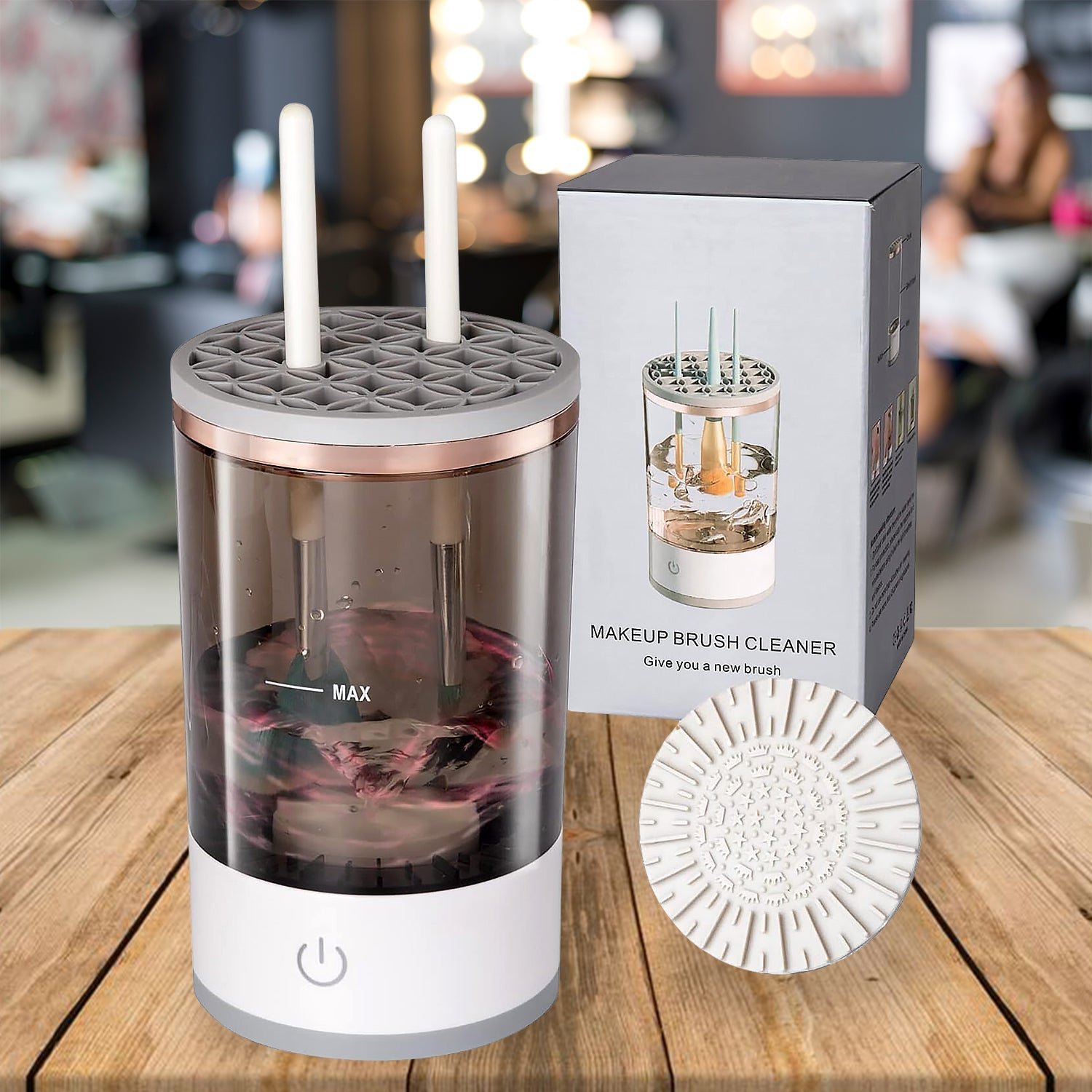 Components of the automatic makeup brush cleaner including base, spindle, and brush collars.