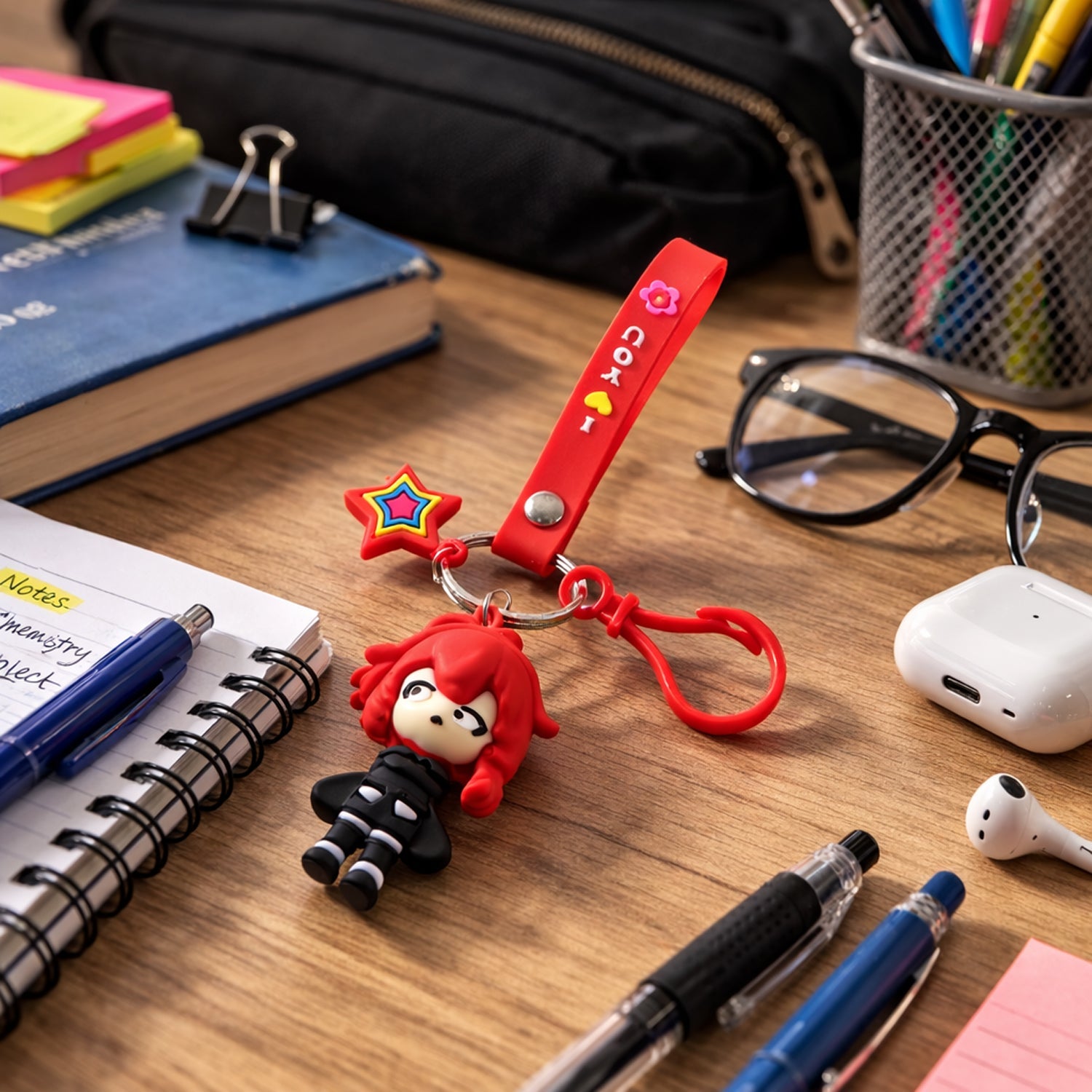 Cute cartoon girl character keychain with strap charm on a bag