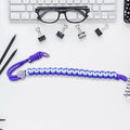 Multicolor adjustable phone wrist strap lanyard displayed on a clean surface.