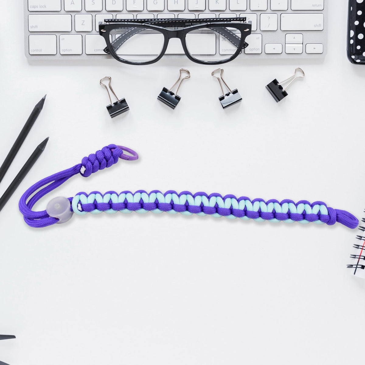 Multicolor adjustable phone wrist strap lanyard displayed on a clean surface.