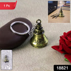 Handcrafted ringing temple bell keychain displayed on black background