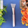 Silicone face mask applicator brush with soft flat silicone head