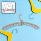 Portable folding clothes hanger in full view, ready for use.