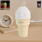 Portable Ice Cream Cone Humidifier releasing cool mist on a desk with LED light
