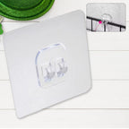 Close-up view of the strong, transparent adhesive surface of the wall hook.