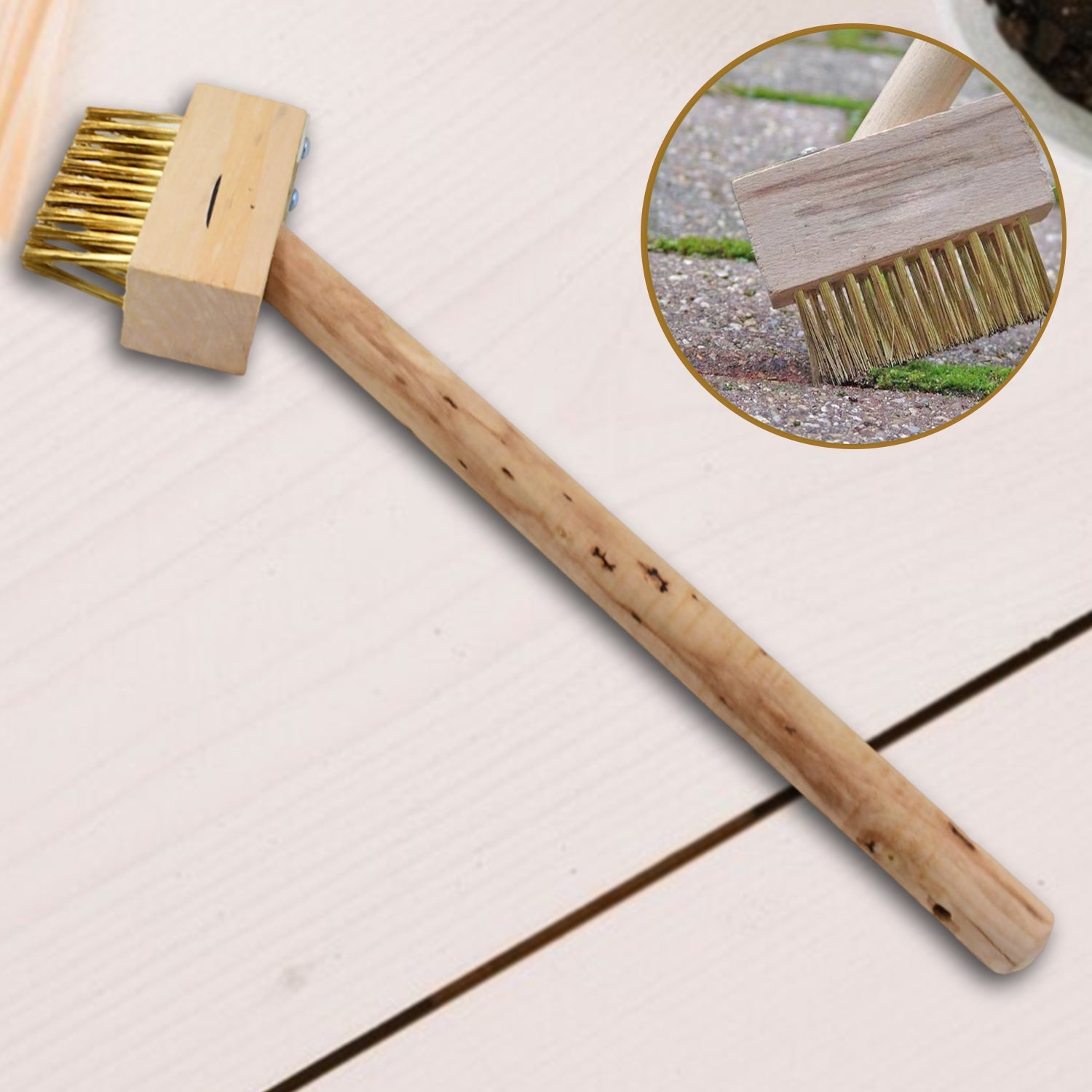 Paving Brush with wooden handle for removing weeds from patio.
