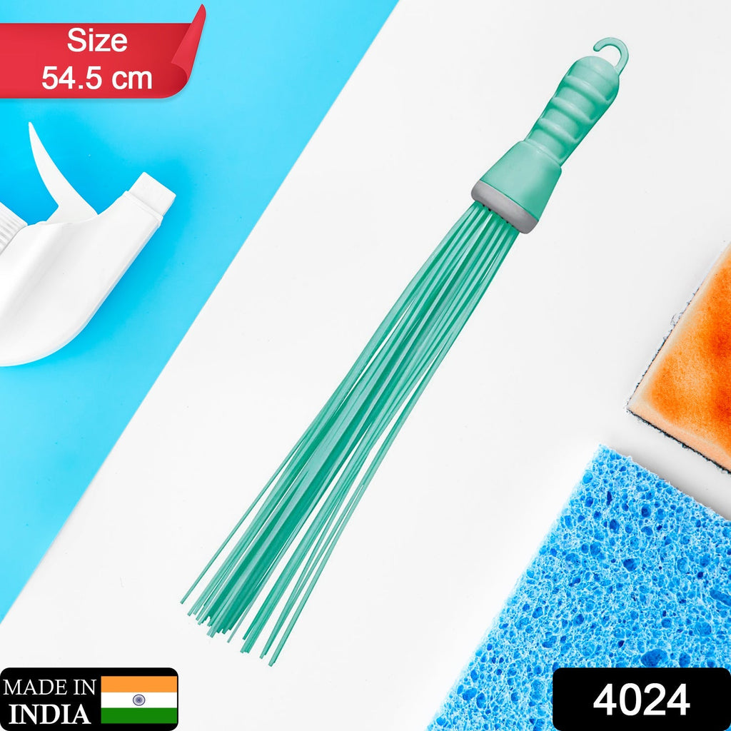Durable plastic broom with stiff bristles, perfect for scrubbing wet and dry floors.