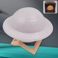 Vibrant 3D Saturn Lamp glowing with multicolor light on a dark background.