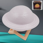 Vibrant 3D Saturn Lamp glowing with multicolor light on a dark background.