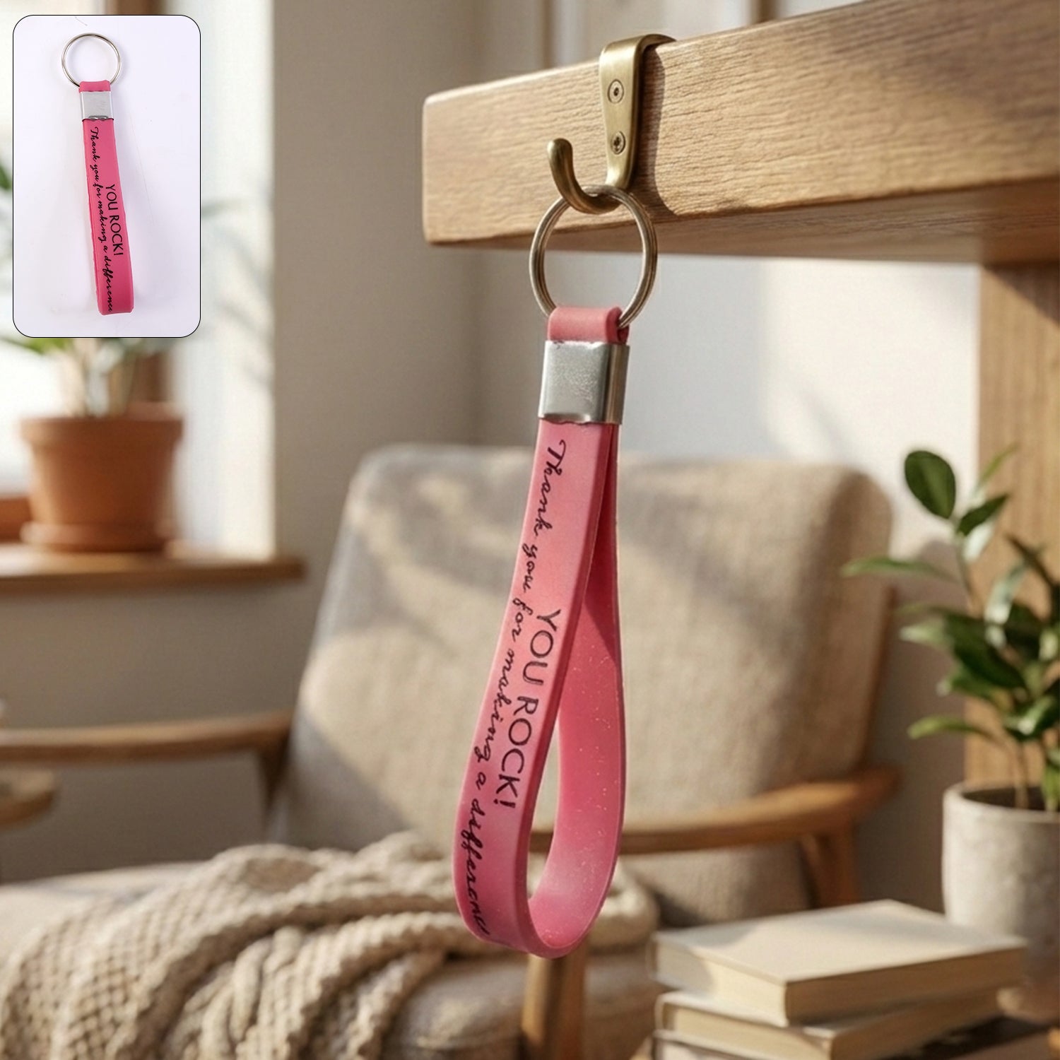 Close-up of motivational silicone wrist strap keychain featuring a metal ring