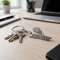metal peepal leaf design keychain with religious symbol