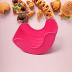 Silicone Burger Holder in use, keeping a hamburger neat.