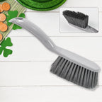 Detail view of the ergonomic long-handle brush from the cleaning kit.