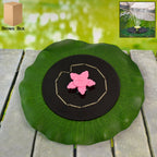 Solar floating water fountain pump with artificial lotus leaf base on garden pond