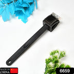 Top-down view of the black silicone toilet brush and its holder, emphasizing its compact design.