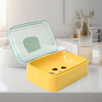 Self-draining soap dish in mixed colors, showcasing its portable design.