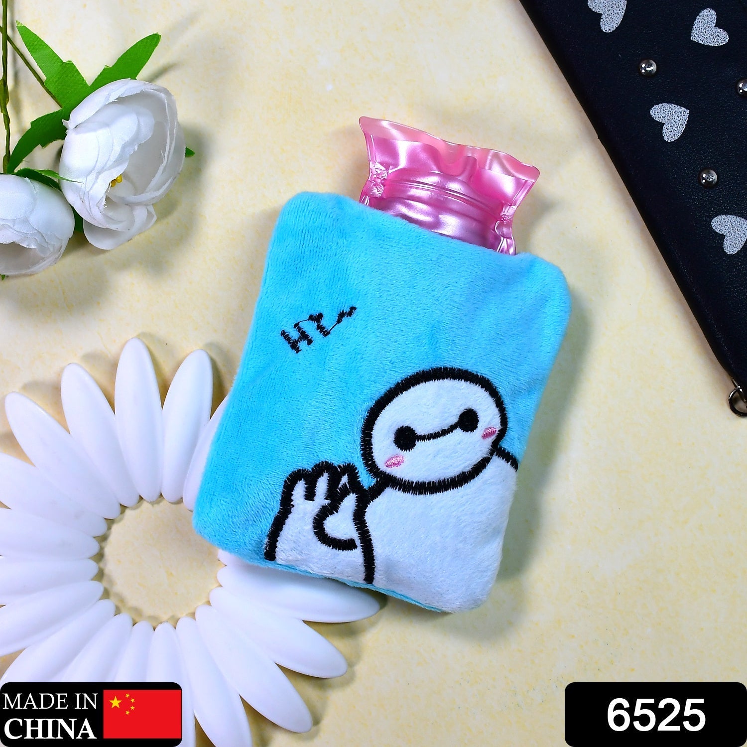 Front view of the small blue Baymax hot water bag, ready for use.