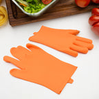Orange silicone thumb knife finger protector glove for right hand, ready for use.