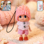 Cute mini doll keychain with knitted cap and vibrant outfit