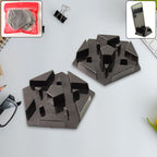 Close-up of multi-angle plastic mobile phone holder showing geometric base