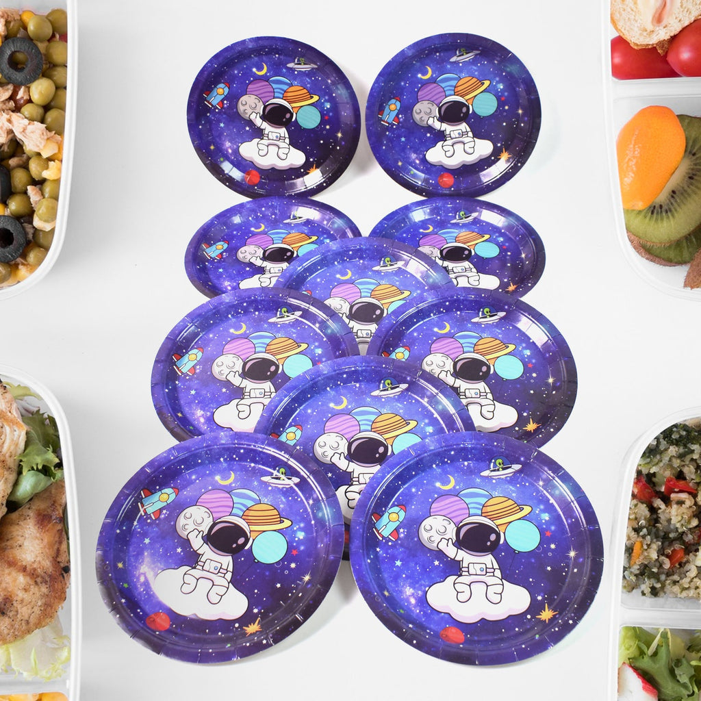 Stack of vibrant disposable paper plates with birthday party designs.