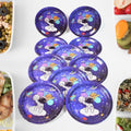 Stack of vibrant disposable paper plates with birthday party designs.