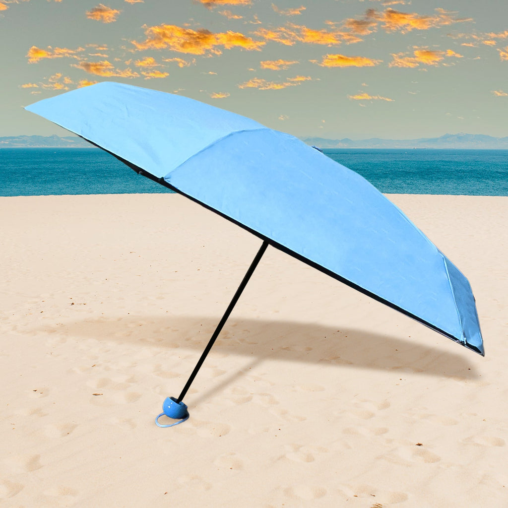 A sleek, black 5-Fold Umbrella neatly stored in its matching capsule case, ready for travel.