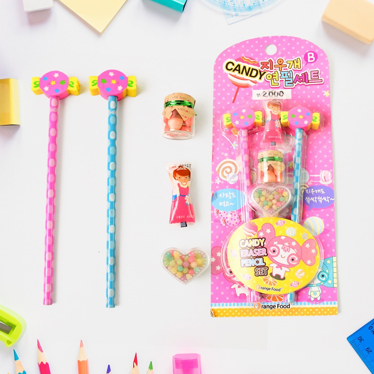 Stationery gift set featuring pencils, eraser, and sharpener with candy motif