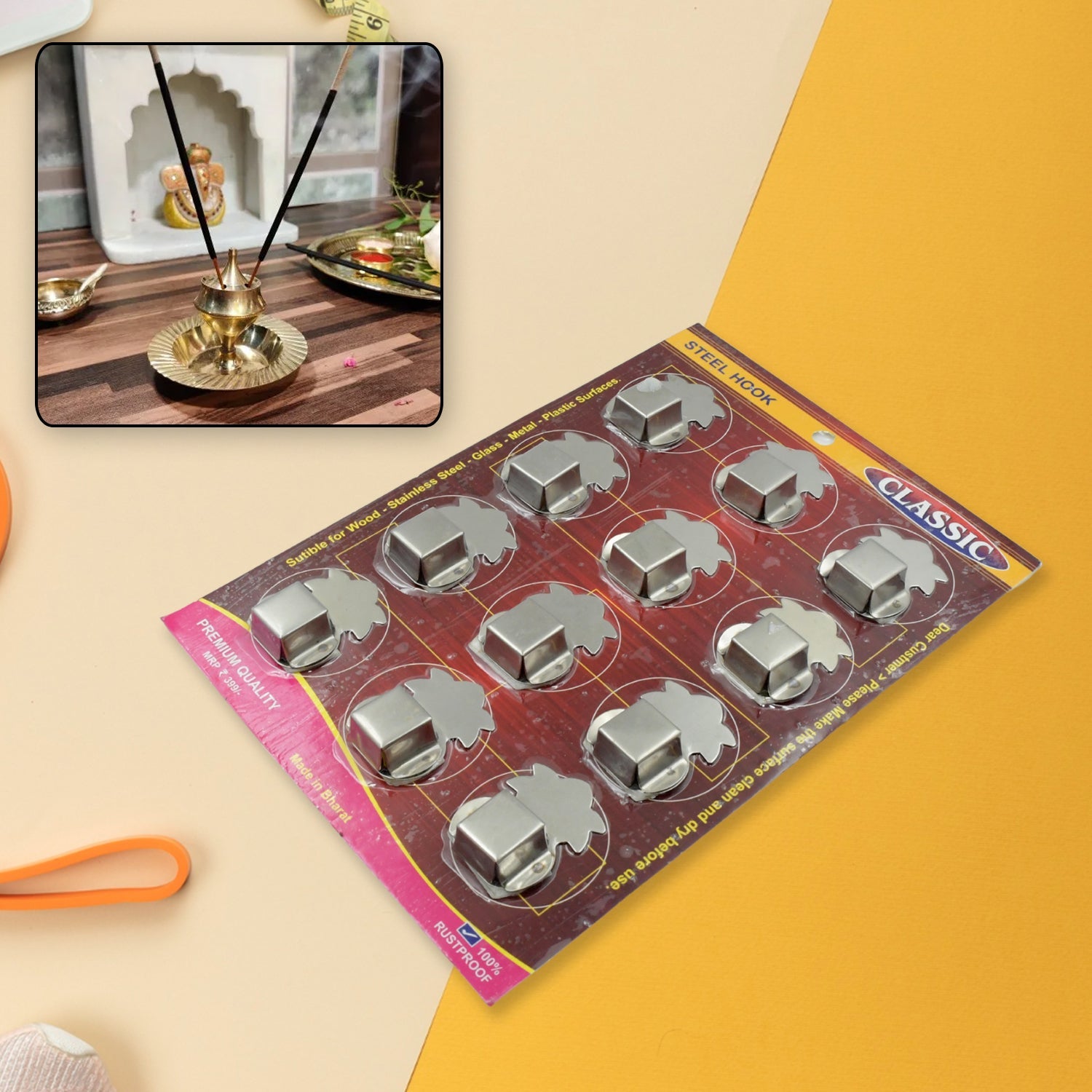 Wall-mounted stainless steel agarbatti stand with incense sticks.