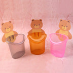 Wall-mounted teddy bear toothbrush holder for kids in bathroom