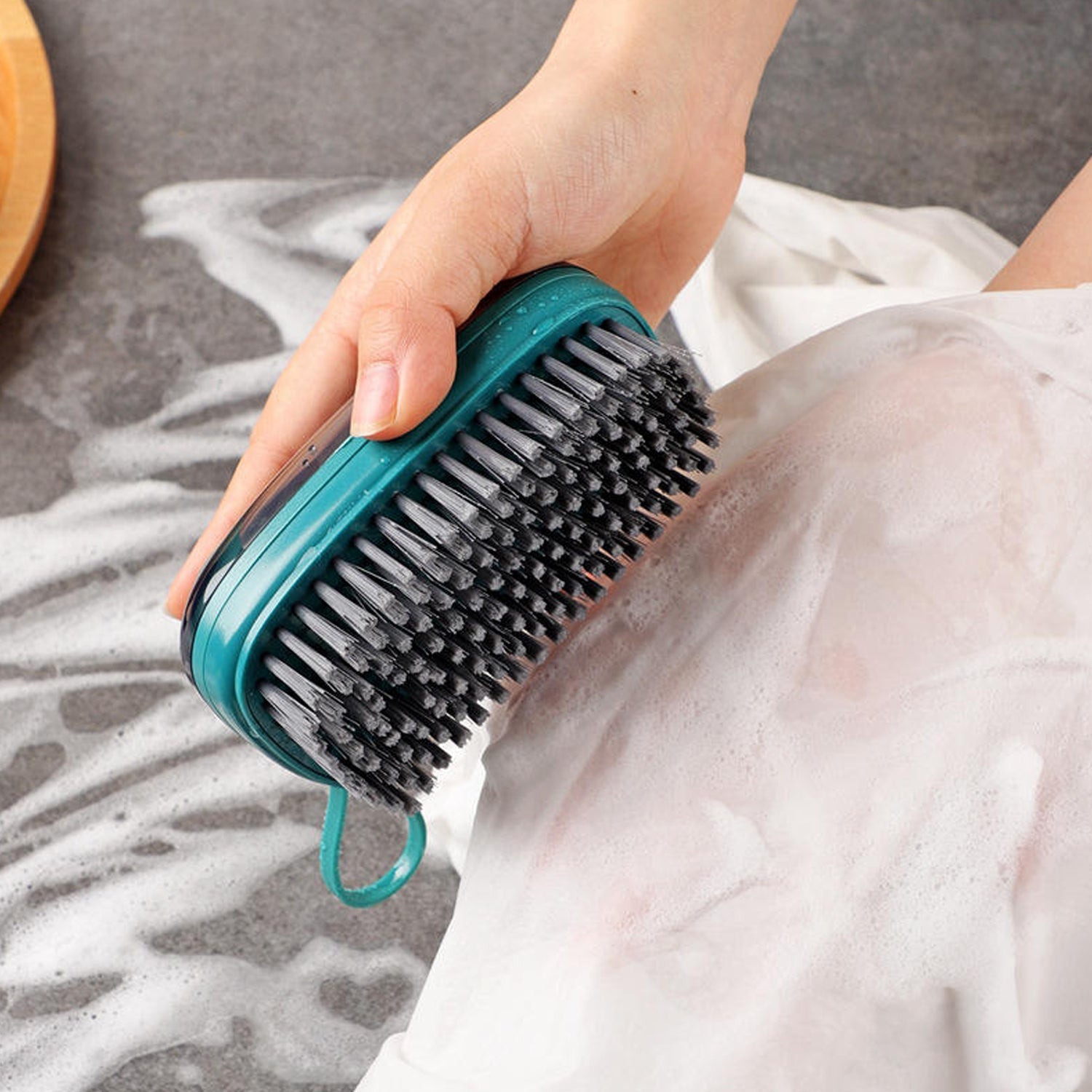 Top view of hydraulic soap dispensing cleaning brush