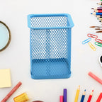 Sleek black metal mesh pen holder for a tidy office desk.
