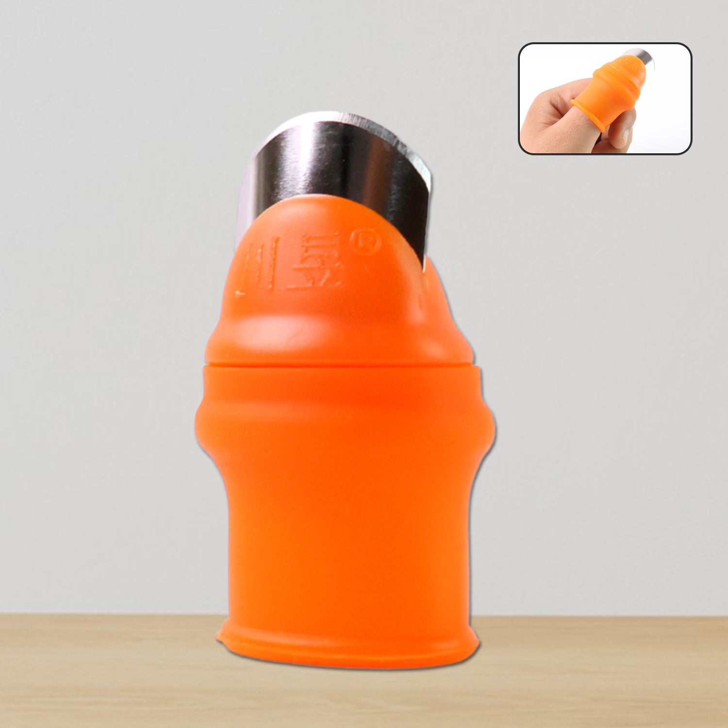 Thumb Knife Cutter with silicone finger guard on thumb