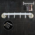 Wall-mounted bath towel hanger securely holding clean towels in a modern bathroom.