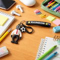 Colorful cartoon football boy keychain with rainbow strap, perfect for backpacks and keys