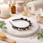 Black gold decorative hairband with floral and pearl design