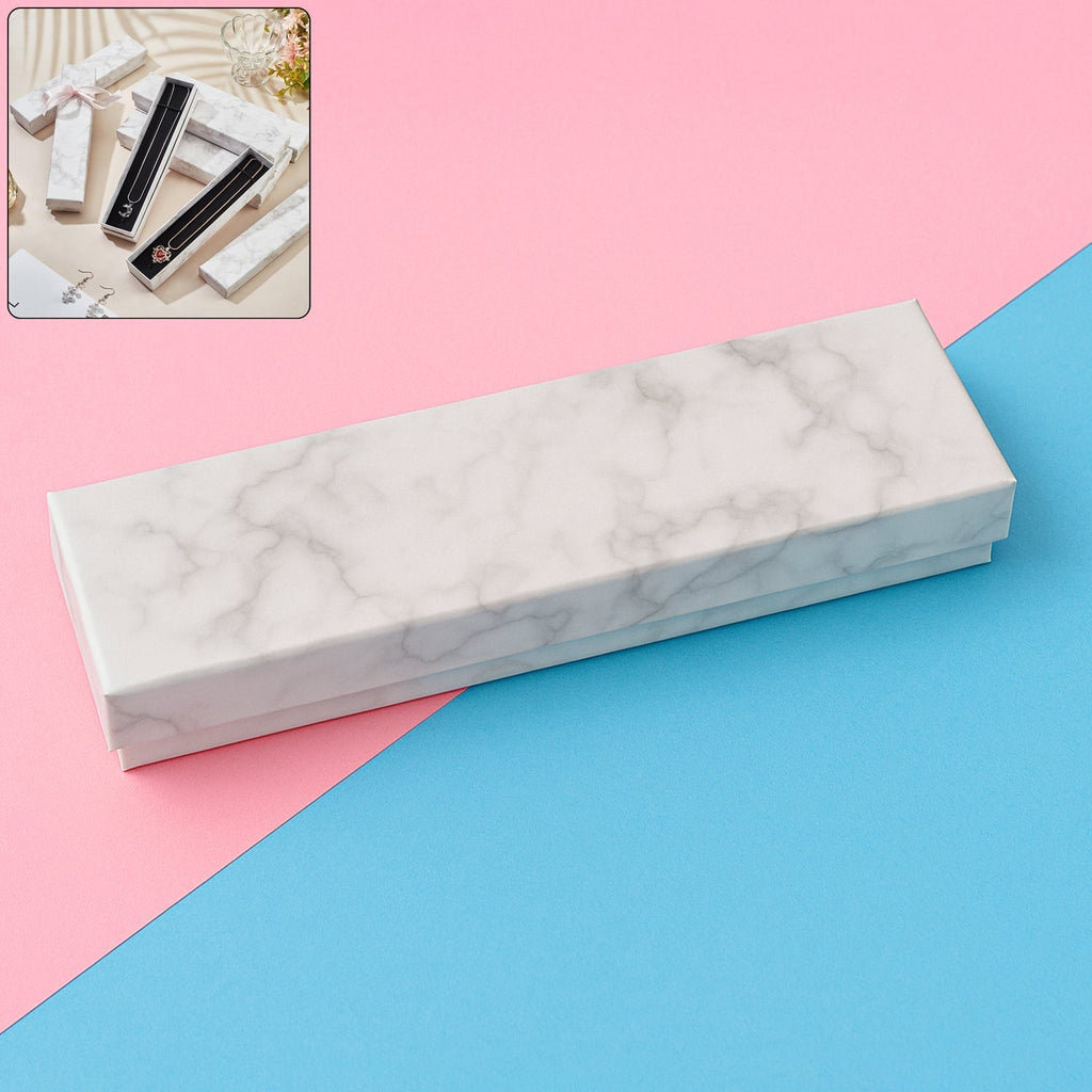 Open empty luxury jewelry gift box showing black velvet insert, ideal for bracelets or bangles.