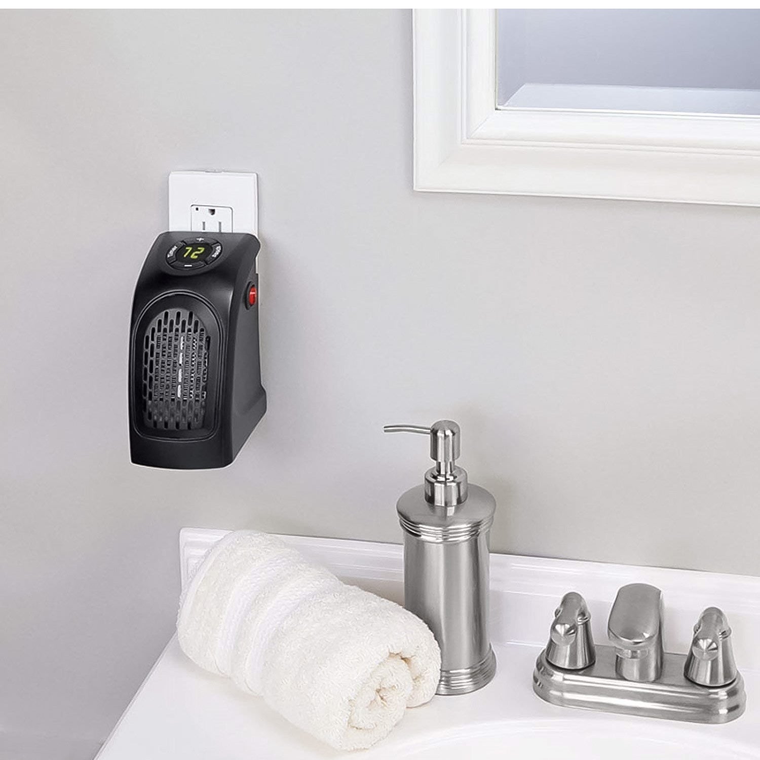 Mini plug-in heater securely plugged into a wall socket for instant heat.