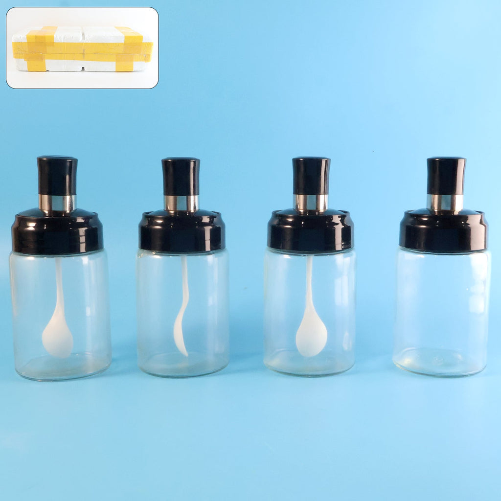 Transparent spice jar with airtight lid and spoon showing clear contents