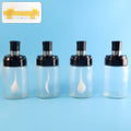 Transparent spice jar with airtight lid and spoon showing clear contents