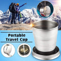 Folding camping cup with keychain, folded on a white background, showcasing its compact size.