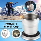 Folding camping cup with keychain, folded on a white background, showcasing its compact size.