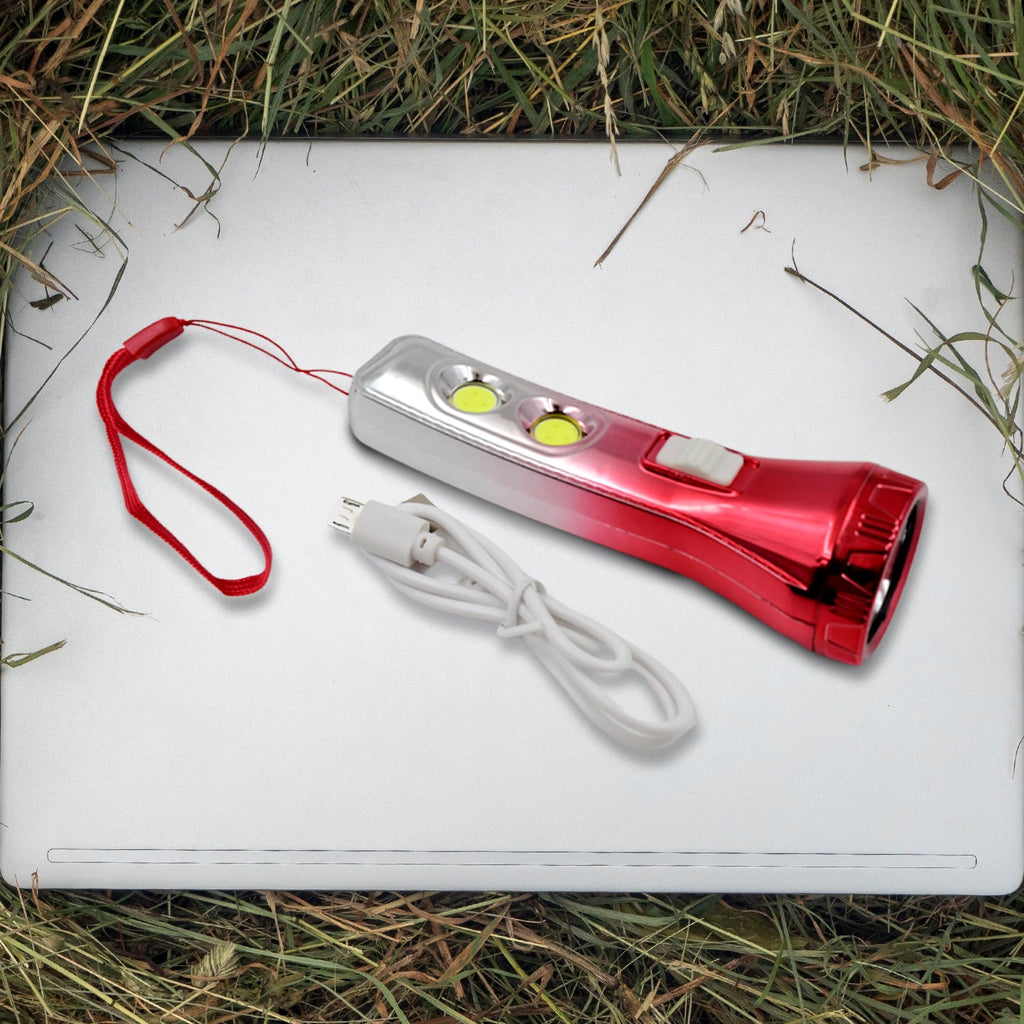 Portable LED torchlight resting on a flat surface, ready for use.