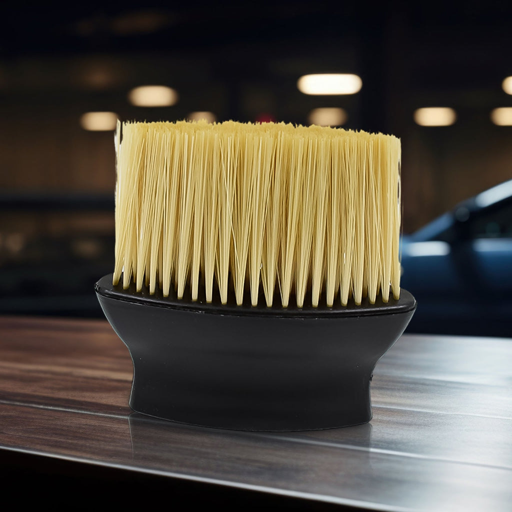 Soft multipurpose cleaning brush with ergonomic handle, ideal for car interiors and keyboards.