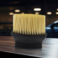 Soft multipurpose cleaning brush with ergonomic handle, ideal for car interiors and keyboards.