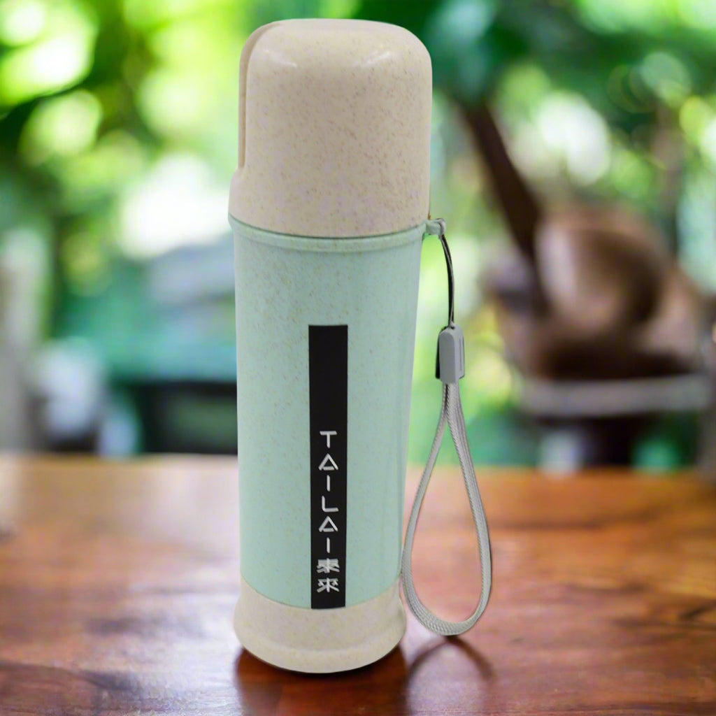 A vibrant mix-color portable water bottle made from wheat straw, shown upright.