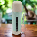 A vibrant mix-color portable water bottle made from wheat straw, shown upright.