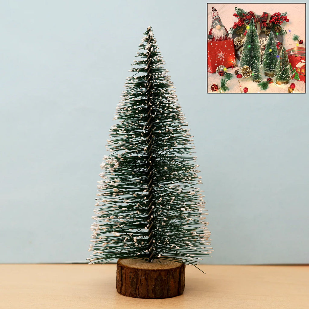 Mini artificial Christmas tree with realistic snow effect on branches and wooden base